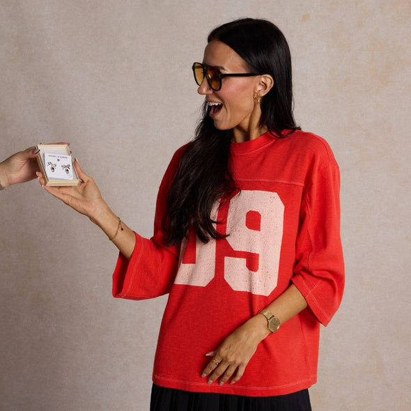 Gold Football & Bow Drop Studs