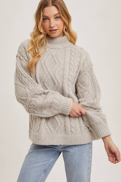 TURTLENECK CABLE KNIT SWEATER